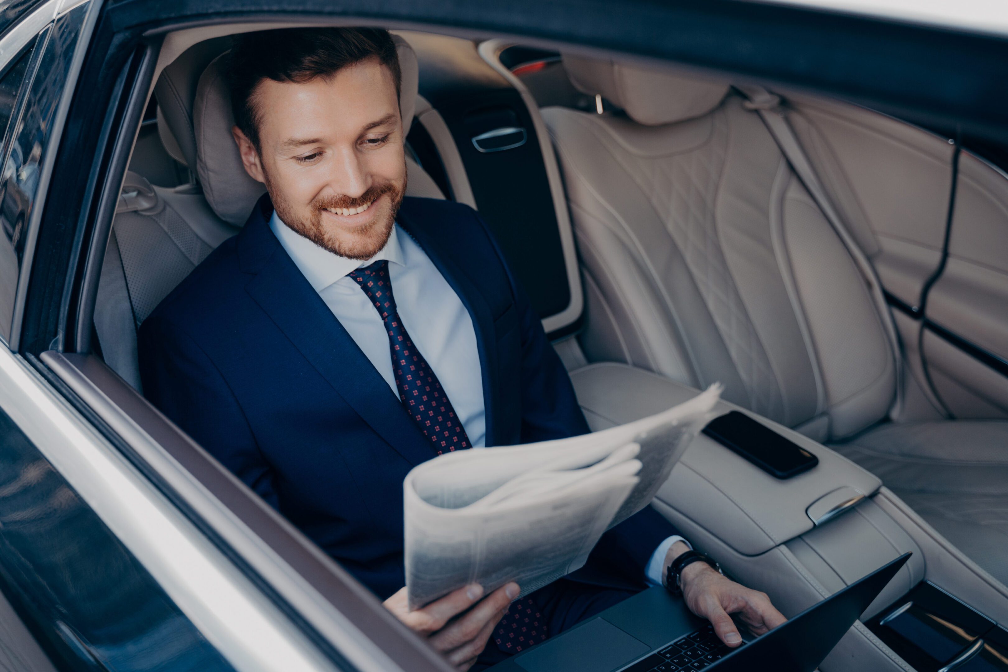 Portrait Of Man Using Mobile Phone While Sitting In Car