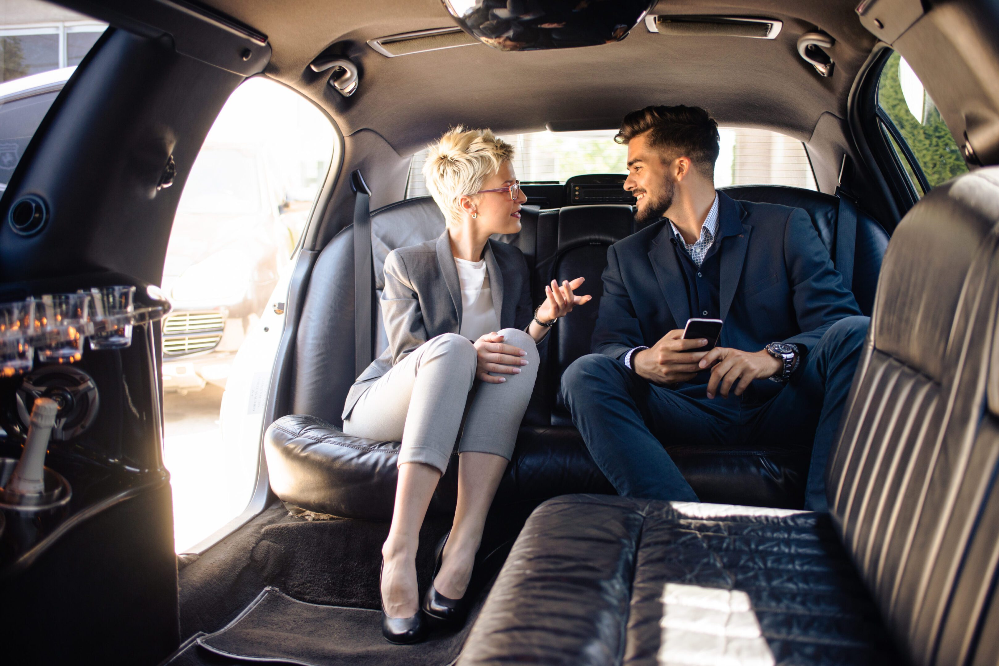 Business people having discussion in limousine